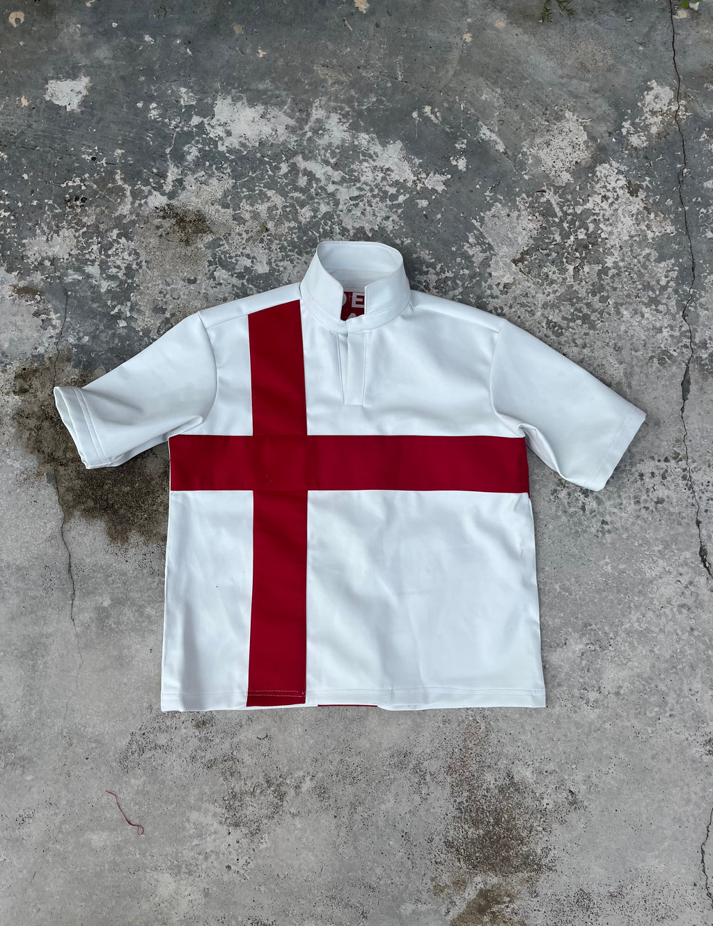 DELANA CROSS LEATHER POLO